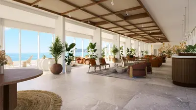 a large room with tables and chairs and plants at Iberostar Selection Montenegro in Bar