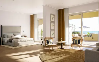 a bedroom with a bed and two chairs at Iberostar Selection Montenegro in Bar