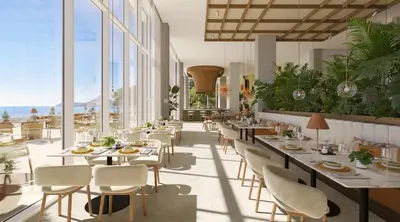 a restaurant with tables and chairs and large windows at Iberostar Selection Montenegro in Bar