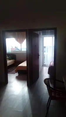 a room with a room with a bed and a window at Apartments Dubrava 106 in Dobra Voda