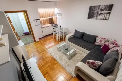 a living room with a couch and a table at Rajka Lux in Podgorica