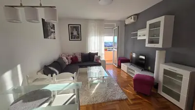 a living room with a couch and a table at Rajka Lux in Podgorica