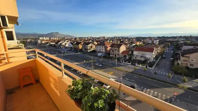 a view of a city from the balcony of a building at Rajka Lux in Podgorica