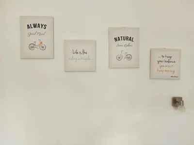 a group of signs on a wall with bikes at Apartments Four Countesses in Virpazar