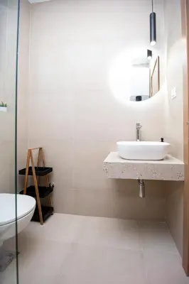 a bathroom with a sink and a mirror at Apartments Sirena - Modern stay with free parking in Budva