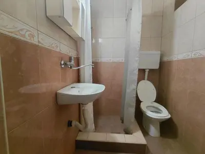 a small bathroom with a sink and a toilet at Snežana in Budva