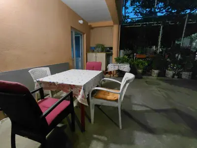 a table and chairs sitting on a patio at Snežana in Budva