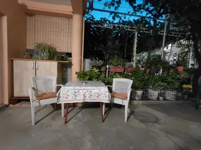 a table and two chairs and a table and a table and chairs at Snežana in Budva