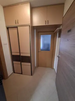 an empty room with a door and a room with a door at Ljubovic prestige apartment in Podgorica