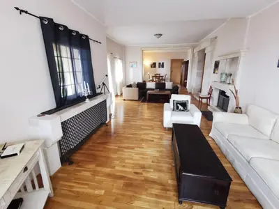 a living room with a white couch and a table at Lux Villa Provence in Budva