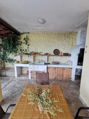 a kitchen with a table and a counter top at Lux Villa Provence in Budva
