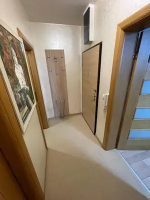a hallway with an open door and a door at Apartment Peace in Podgorica