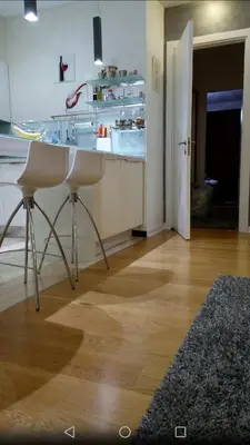 a kitchen with a counter and a sink in a room at DeLux and Urban apartments Hotel Tre Canne Budva in Budva