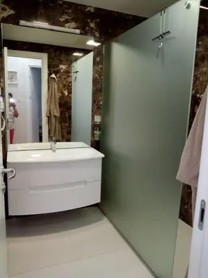 a bathroom with a tub and a sink and a mirror at DeLux and Urban apartments Hotel Tre Canne Budva in Budva
