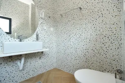 a bathroom with a sink and a mirror and a toilet at Lux Čanj in Čanj