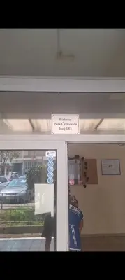 a sign on the door of a building at Sicilija apartment in Podgorica
