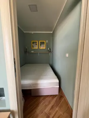 a small bedroom with a bed in a room at Cherry in Dobra Voda