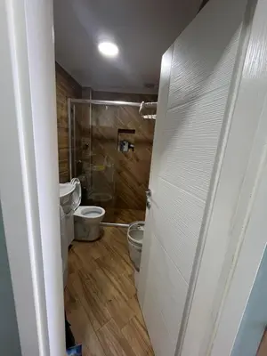 a bathroom with a toilet and a glass shower at Cherry in Dobra Voda