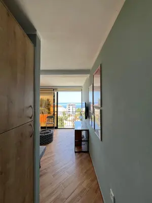 an open hallway with a view of a living room at Cherry in Dobra Voda