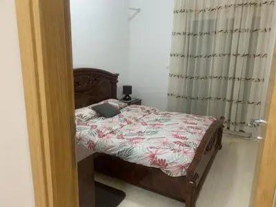 a bedroom with a bed with a laptop on it at Apartman SA&BO in Podgorica