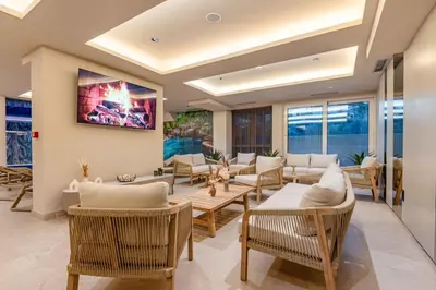 a living room with wicker chairs and tables at Obrad Pržno See View in Kamenovo
