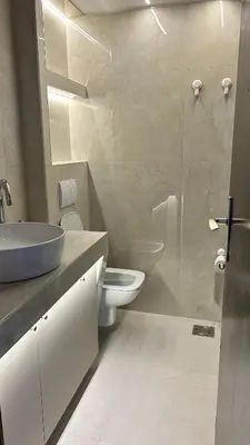 a bathroom with a toilet and a sink and a shower at Stay In Bar in Bar