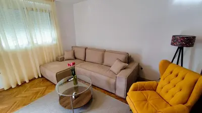 a living room with a couch and two chairs at Stay In Bar in Bar