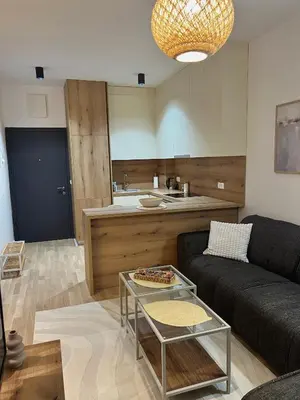 a living room with a couch and a table at Family Homes Bar Apartment in Bar