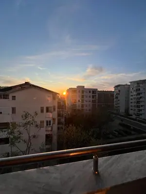 a view of the sunset from a balcony of a city at Family Homes Bar Apartment in Bar
