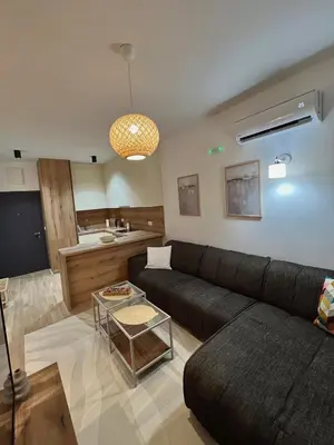 a living room with a couch and a table at Family Homes Bar Apartment in Bar