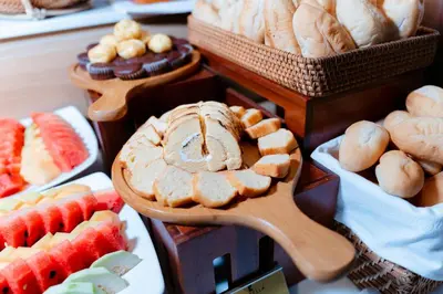 a display of different types of bread and pastries at Aqua Lounge Aparthotel Ulcinj in Ulcinj