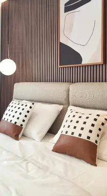 a bedroom with a bed with two pillows at Stylish City Living Elegant One Bedroom Apartment in Podgorica