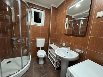 a bathroom with a toilet and a sink and a shower at Lucky Space 3 Apartment in Budva