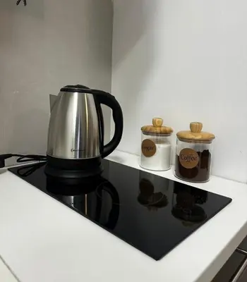 a coffee pot sitting on top of a stove at Apartman 2937 in Podgorica