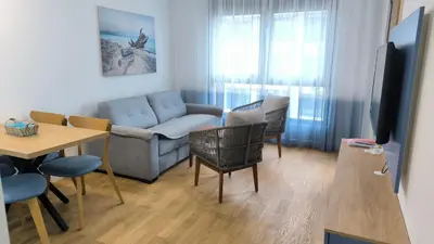 a living room with a couch and a table at Apartments LORA Novi Bar in Bar