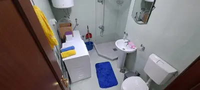 a small bathroom with a toilet and a sink at Nikola apartment in Podgorica