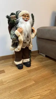 a santa claus figurine standing on a floor at Phenix Apartments Parking FREE in Podgorica