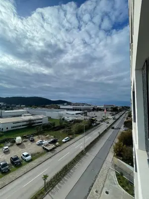 a view of a highway with cars parked in a parking lot at Triumph residence Bar in Bar