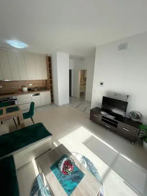 a living room with a couch and a table at Triumph residence Bar in Bar