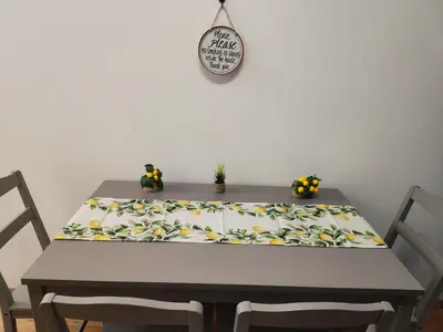 a dining room table with a table cloth on it at Apartments Sunny in Becici