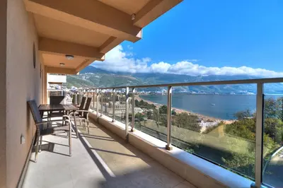 a balcony with a view of the water at Apartments Location by Chabad House in Becici