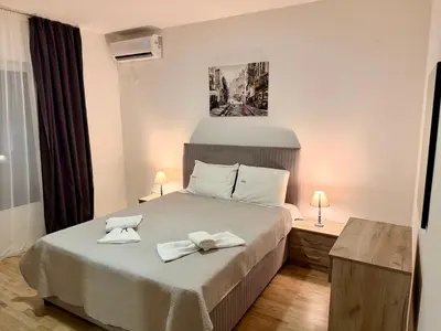 a bedroom with a bed with two towels on it at M apartment 3 in Bar
