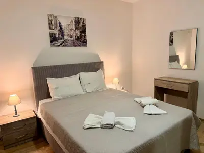 a bedroom with a bed with two towels on it at M apartment 3 in Bar