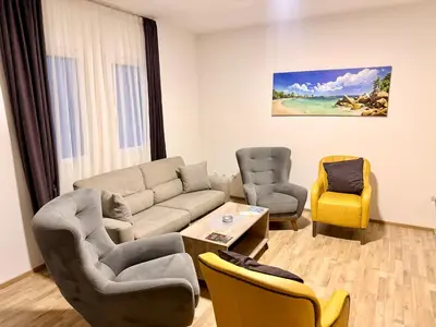 a living room with a couch and chairs at M apartment 3 in Bar