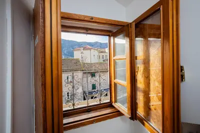 a window with a view of a city at Tara Rooms In The Heart Of Old Town Kotor in Kotor