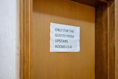 a sign on a door that reads only for the guests from utensils rooms at Tara Rooms In The Heart Of Old Town Kotor in Kotor
