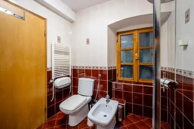 a bathroom with a toilet and a sink at Tara Rooms In The Heart Of Old Town Kotor in Kotor