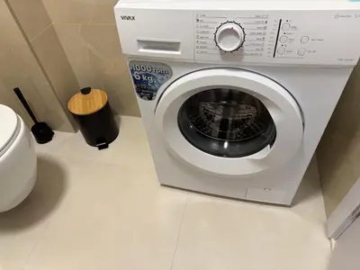 a washing machine in a bathroom with at Zati Homes Ulcinj in Ulcinj