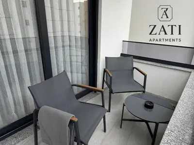 two chairs and a table in a waiting room at Zati Homes Ulcinj in Ulcinj