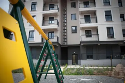 a playground in front of an apartment building at Posh Residence Podgorica in Podgorica